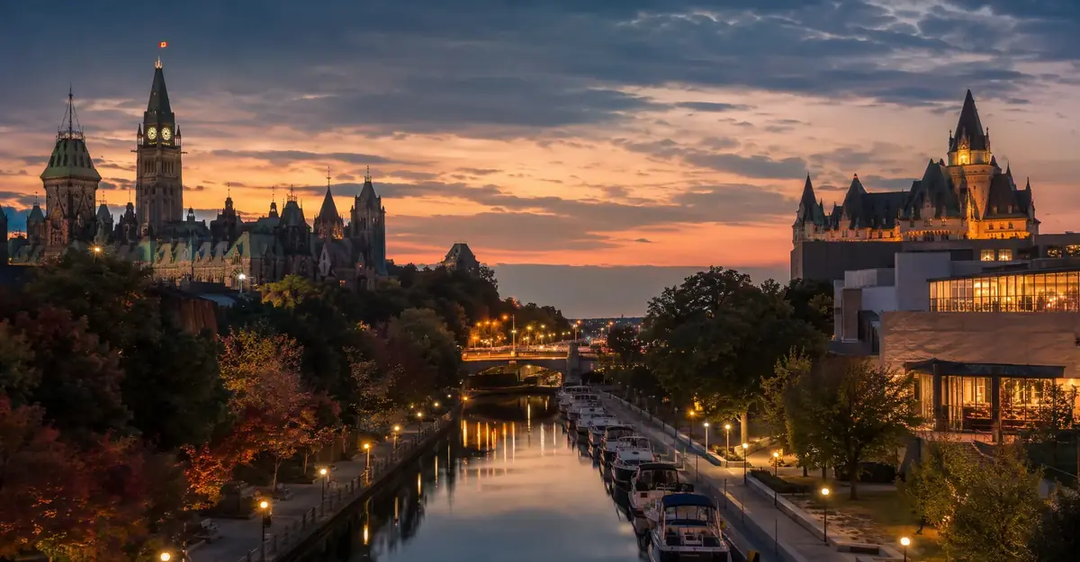 Evening view of the Rideau Canal and Parliament Hill in warm dusk light